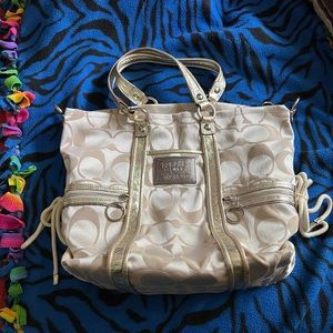 Authentic Coach Poppy Gold/Crème large shoulder purse with Pink Inside.